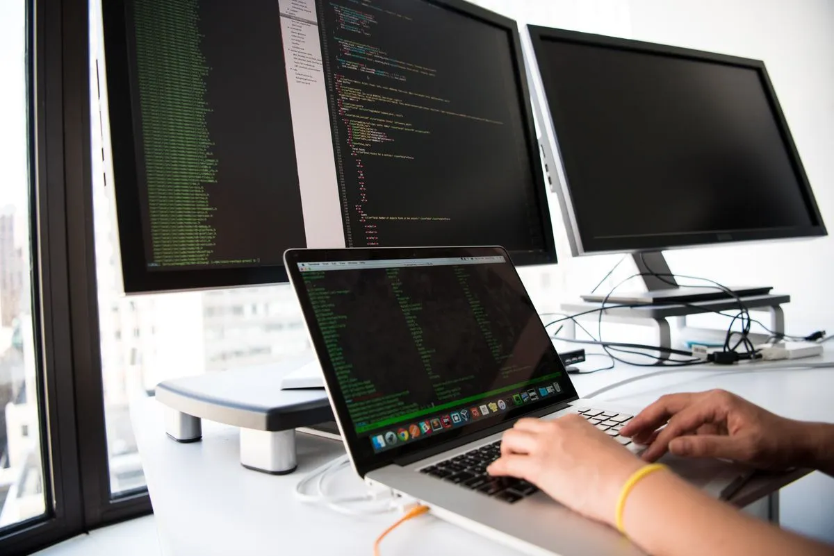A multi-screen workstation processing code and data